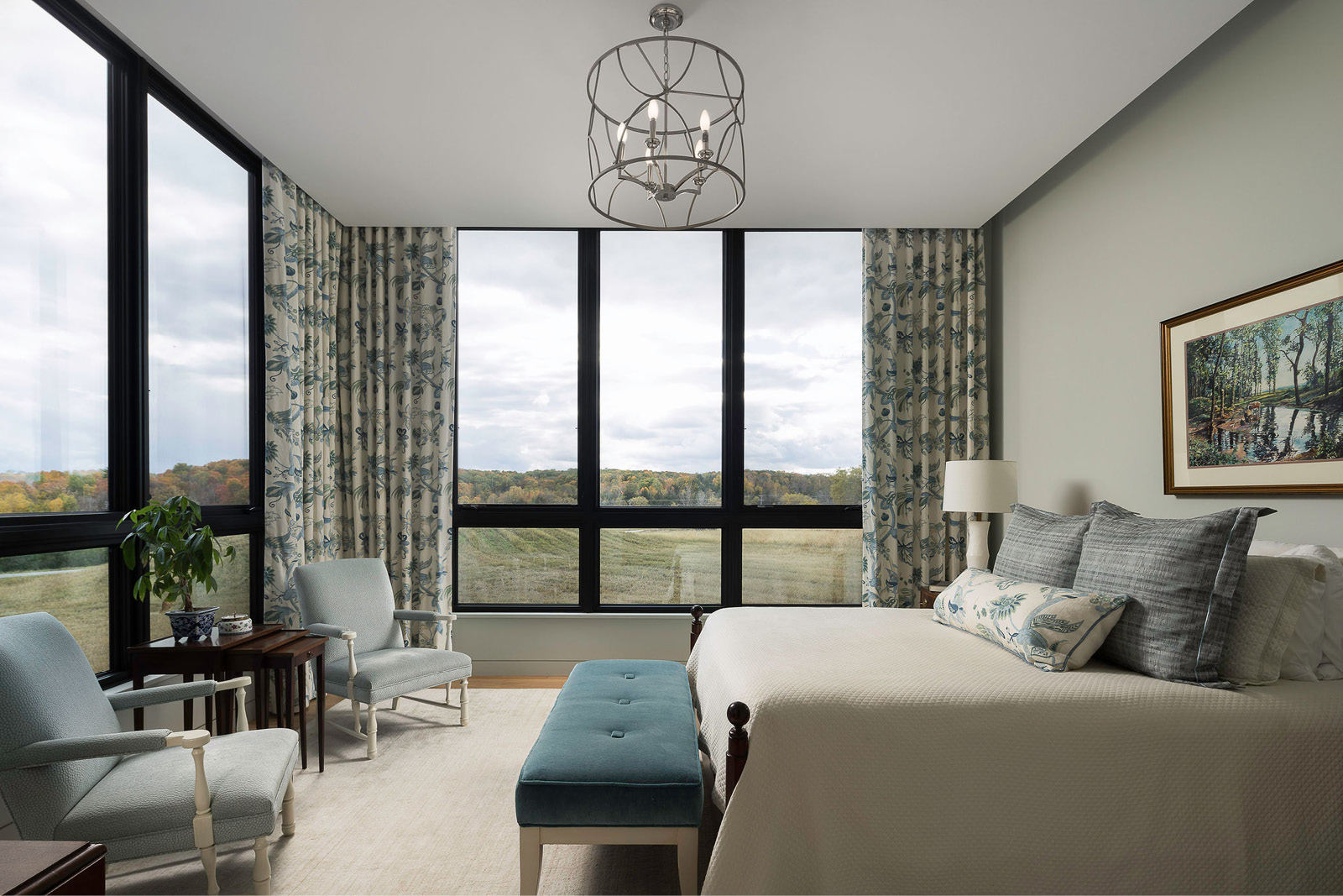 Primary suite with custom windows, window treatments, and stunning views of Elkhart Lake, Wisconsin