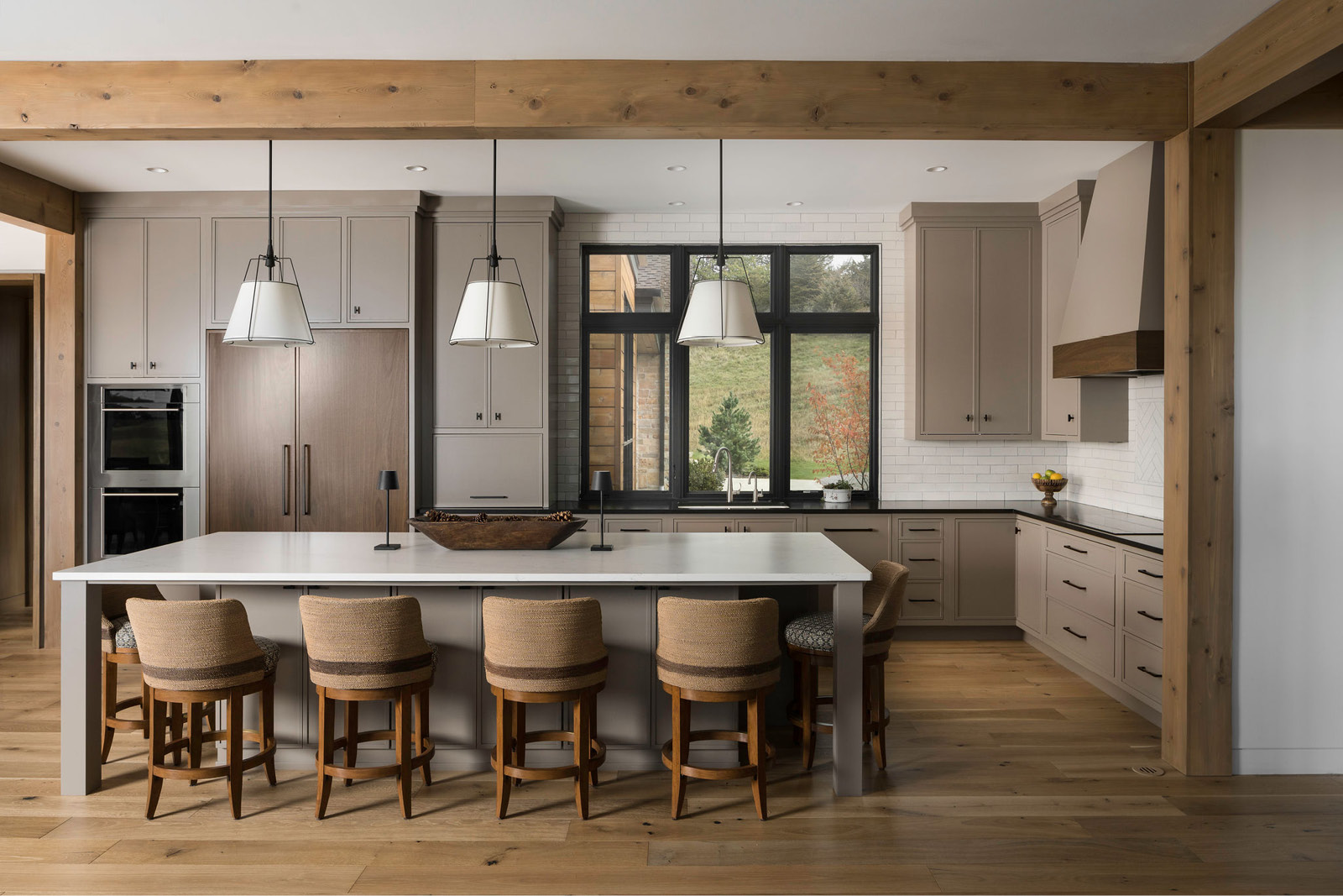 Modern Kitchen Design with custom cabinetry, quartz countertops and statement lighting.