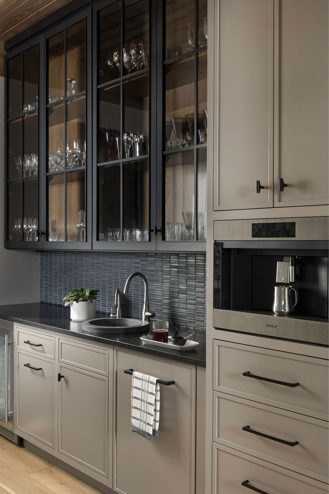 Custom Wet Bar featuring espresso maker, wine fridge and custom cabinetry