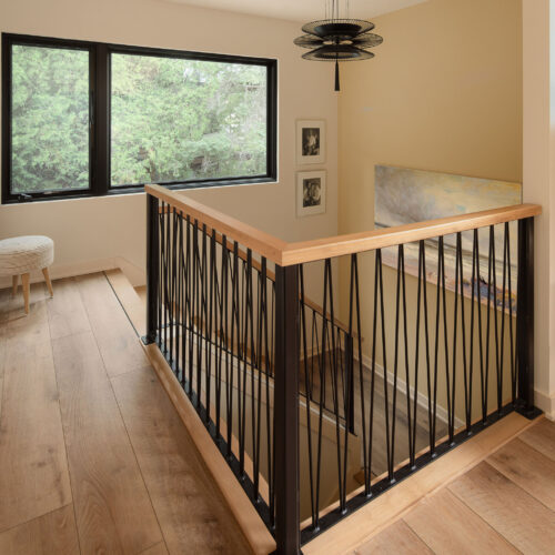 The MCM Lake House – Loft landing Custom steel railing at the upper landing of a mid-century modern Wisconsin lake house