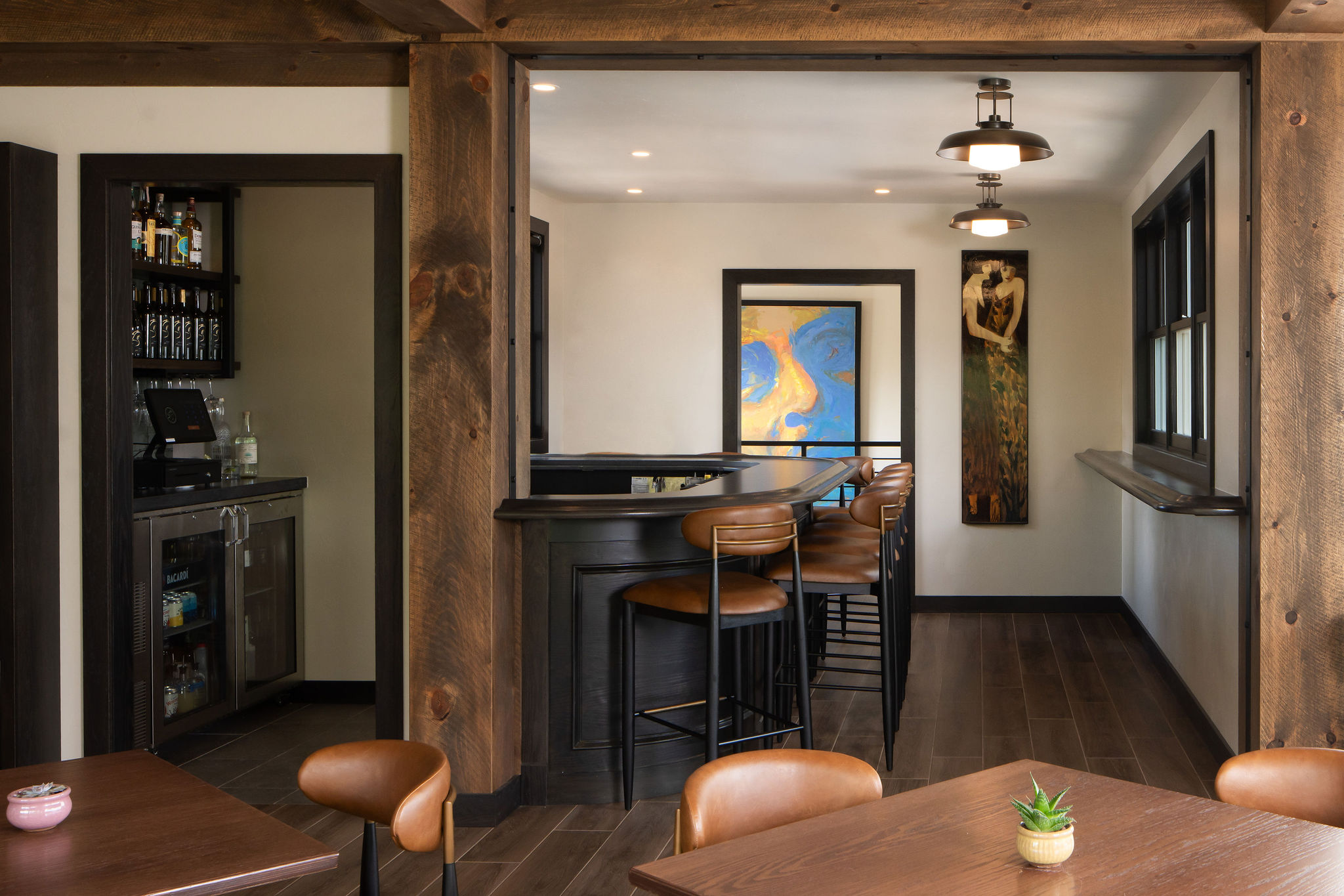 Upper-level winery bar at The Blind Horse Terrace in Kohler, Wisconsin, with warm wood and leather seating