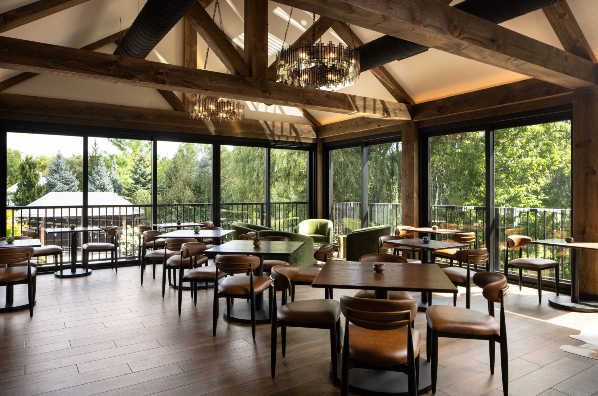 The Lookout at The Blind Horse Terrace in Kohler, Wisconsin, with expansive windows, warm wood, and dining seating