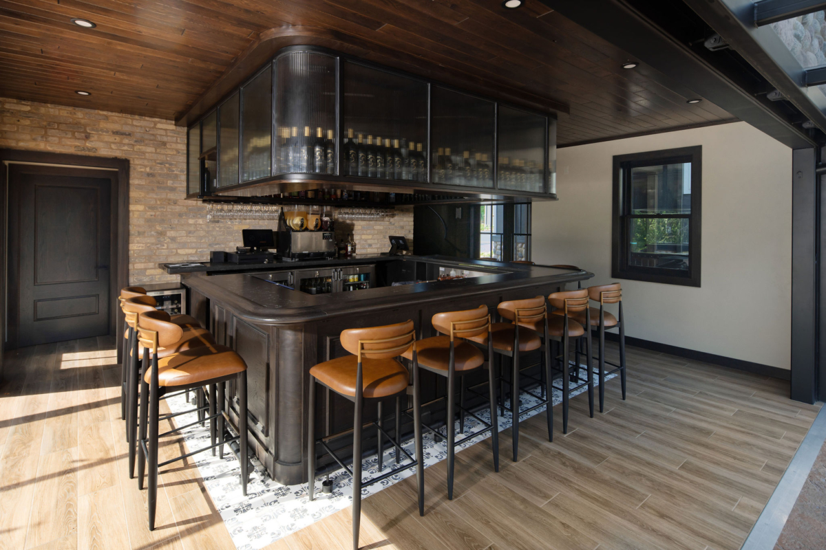 Custom Terrace Bar at The Blind Horse Terrace in Kohler, Wisconsin, with wood finishes and suspended bottle storage